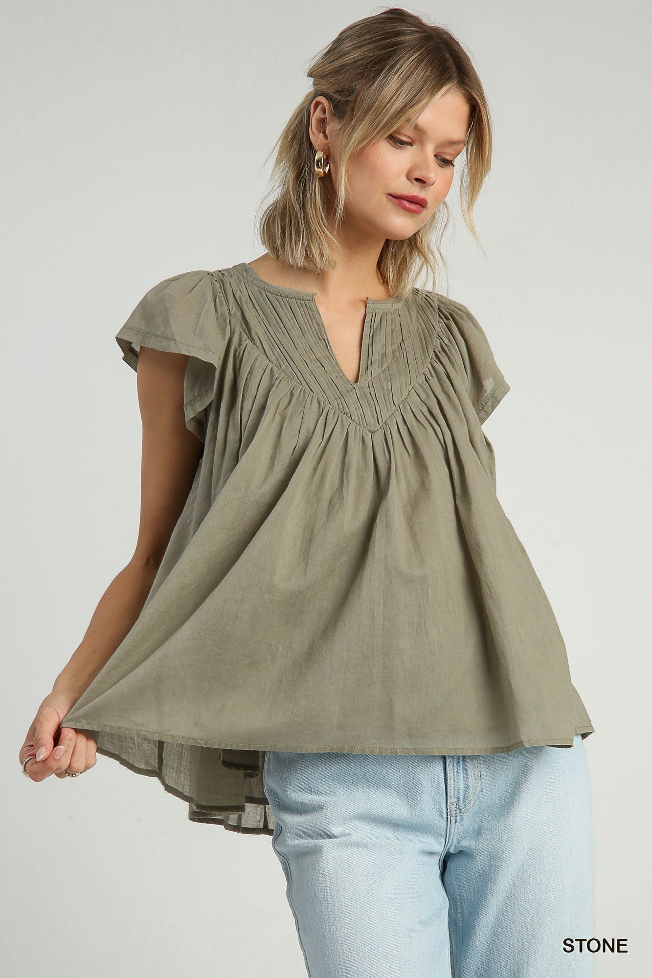 Pleated split neck blouse in Stone