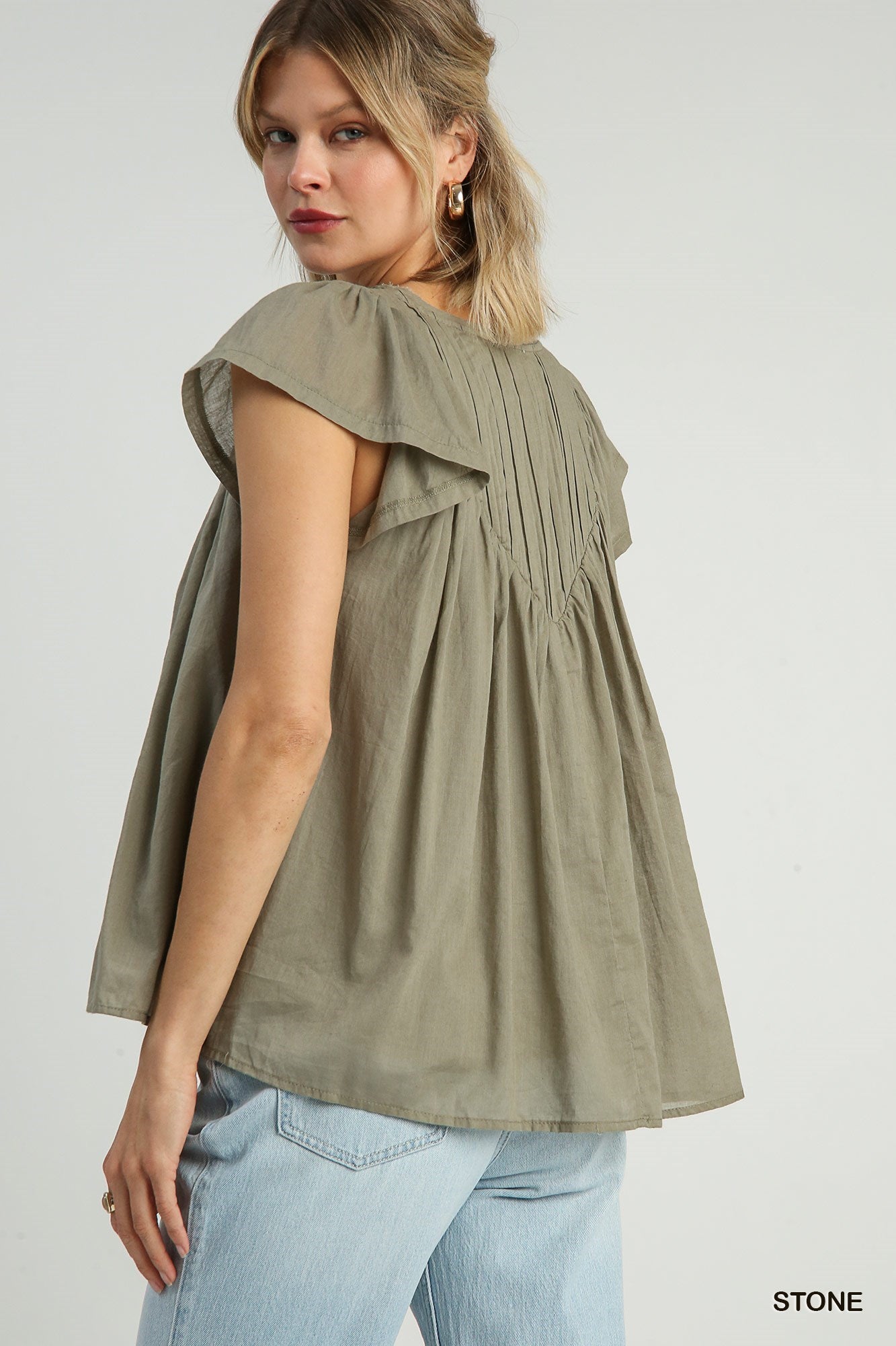 Pleated split neck blouse in Stone