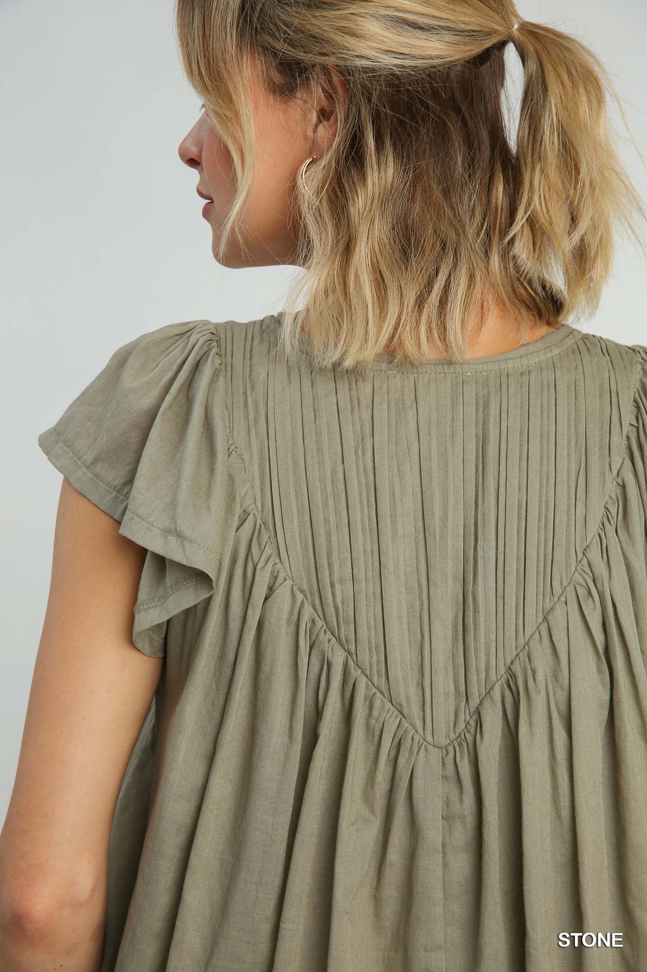 Pleated split neck blouse in Stone