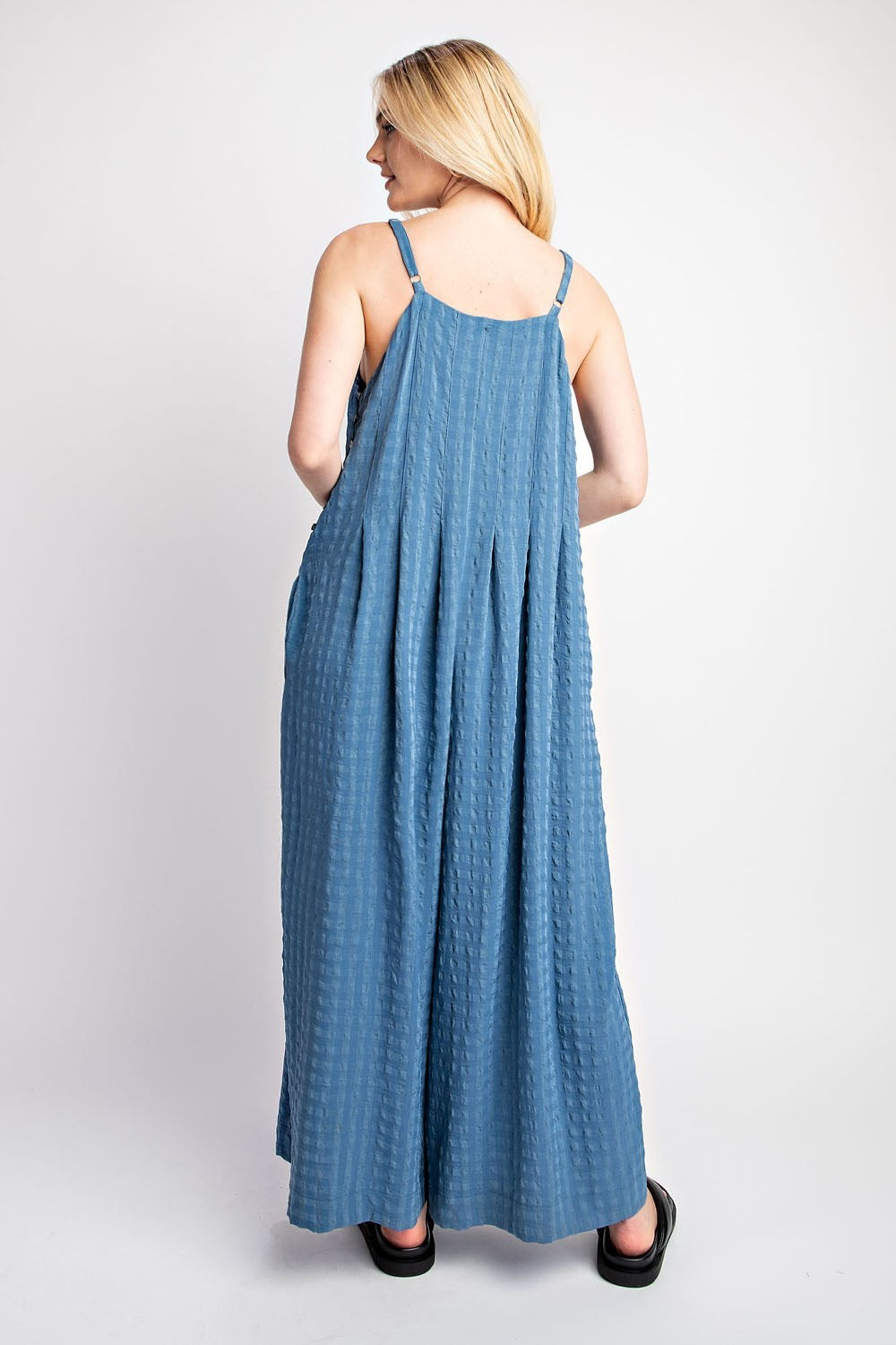 Textured Woven Sleeveless Jumpsuit in the color Denim