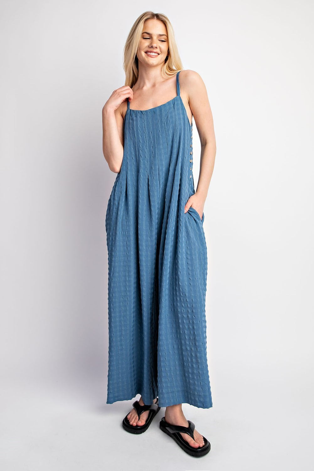 Textured Woven Sleeveless Jumpsuit in the color Denim