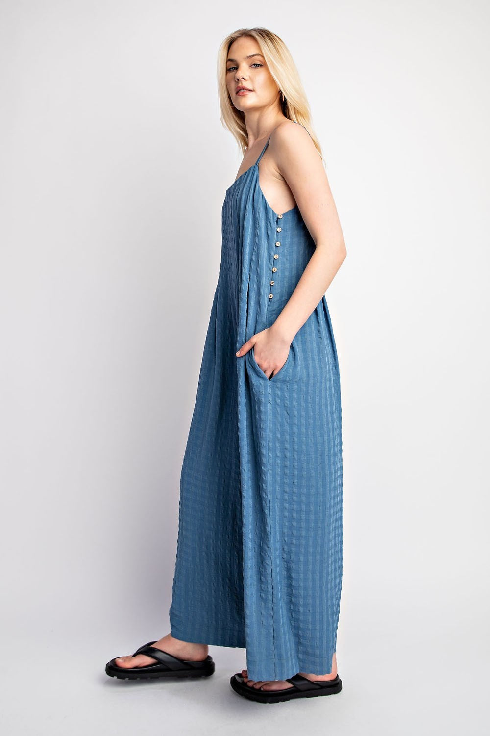 Textured Woven Sleeveless Jumpsuit in the color Denim